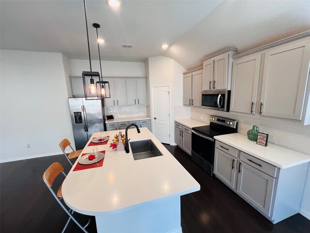 dining room with vaulted ceiling, ceiling fan, dark wood-type flooring, and sink