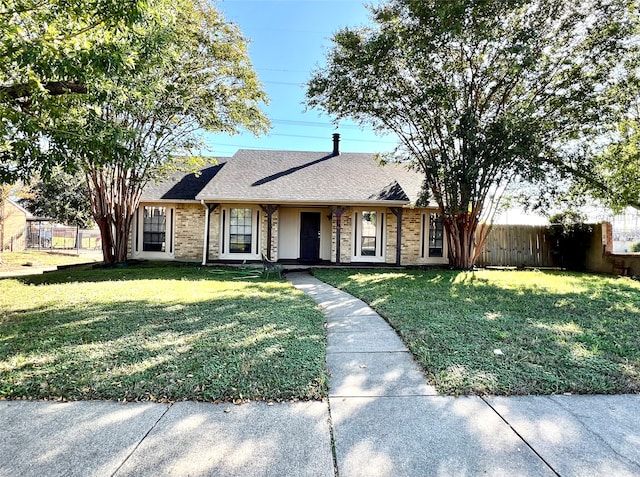 ranch-style house featuring a front lawn