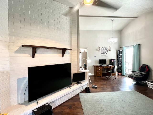 living room with hardwood / wood-style floors, a textured ceiling, and high vaulted ceiling