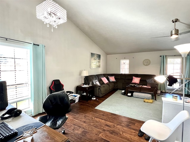 living room with dark hardwood / wood-style flooring and vaulted ceiling