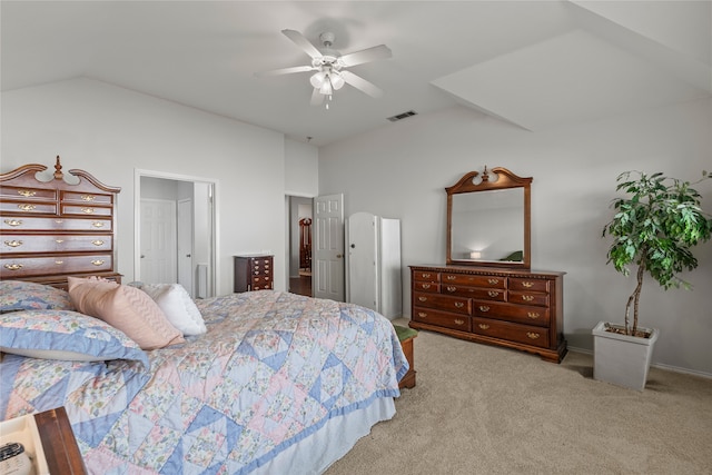 carpeted bedroom featuring vaulted ceiling and ceiling fan