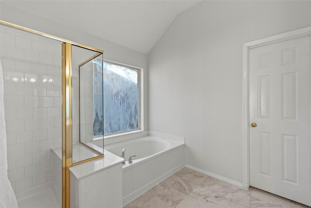 bathroom with separate shower and tub and vaulted ceiling