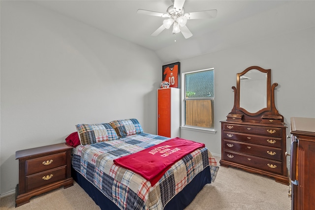 bedroom featuring ceiling fan, light colored carpet, and lofted ceiling