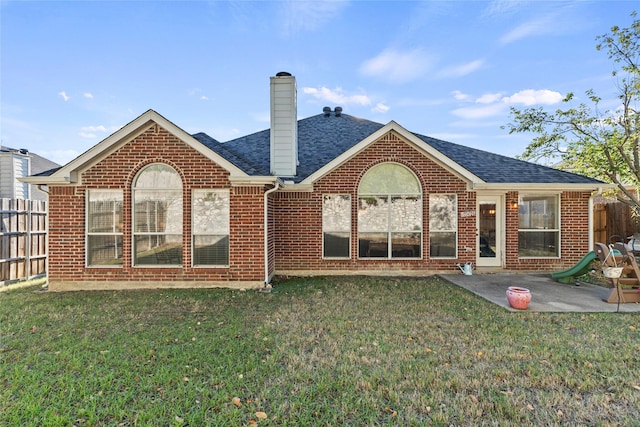 1431 Murphy Dr, Rockwall, TX 75087 - rear view of property featuring brick siding, a patio, a chimney, and roof with shingles