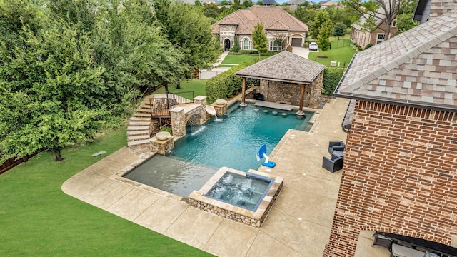 view of swimming pool with an in ground hot tub, pool water feature, a yard, and a gazebo