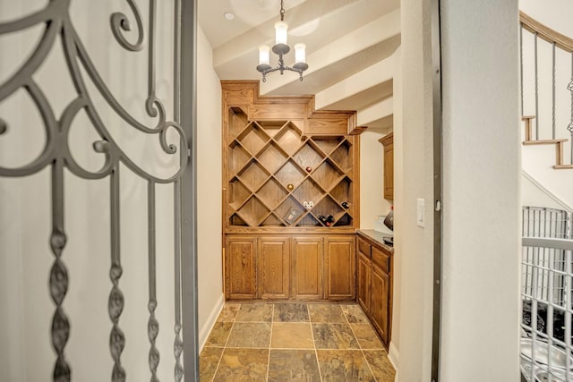 wine room featuring a chandelier