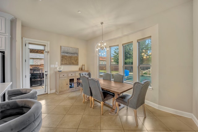 dining area with a notable chandelier and light tile patterned flooring