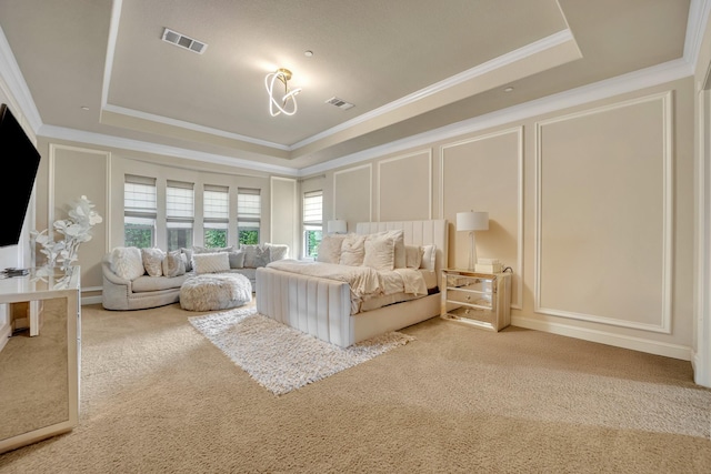 unfurnished bedroom with crown molding, a tray ceiling, and carpet flooring