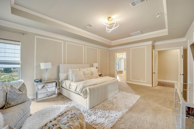 carpeted bedroom featuring ornamental molding and a raised ceiling