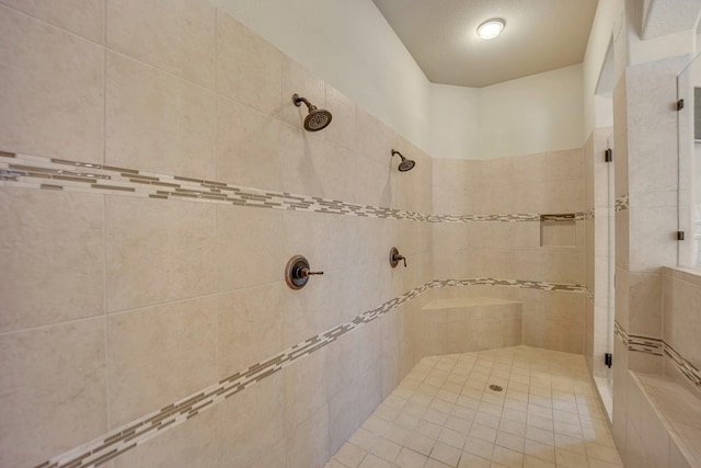 bathroom with tiled shower