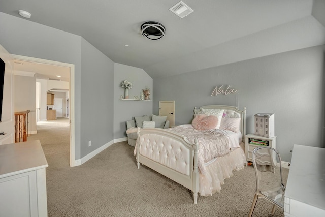 carpeted bedroom with vaulted ceiling