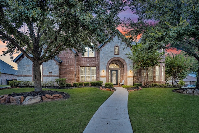 view of front of home with a yard