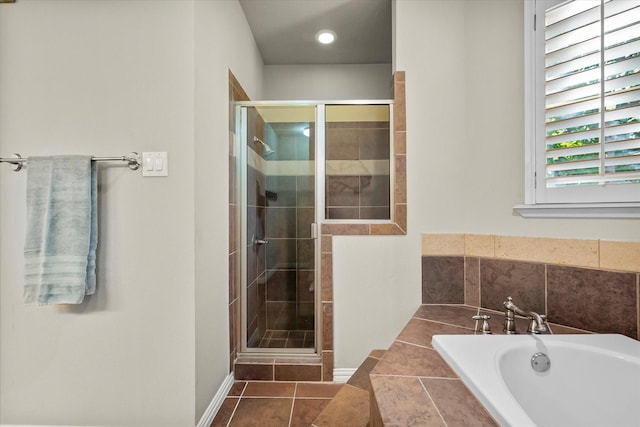 bathroom with tile patterned flooring and plus walk in shower