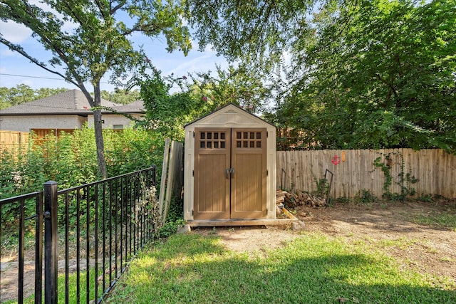 view of outbuilding featuring a lawn