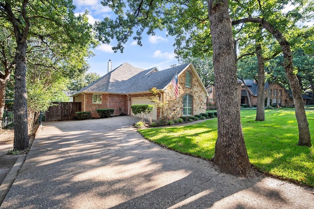 view of front of home featuring a garage and a front yard