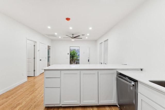 kitchen with kitchen peninsula, white cabinets, ceiling fan, light hardwood / wood-style flooring, and dishwasher