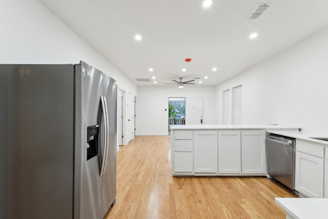 kitchen with ceiling fan, light hardwood / wood-style flooring, white cabinets, and appliances with stainless steel finishes