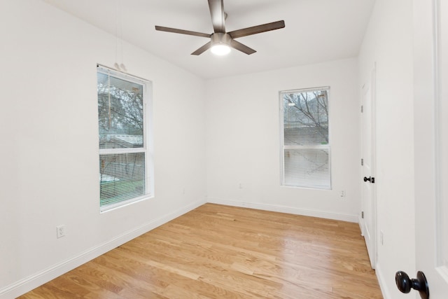 unfurnished room with ceiling fan and light hardwood / wood-style flooring