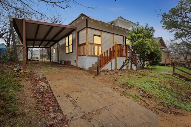 view of property exterior with a carport