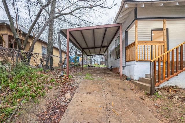 view of side of home featuring a carport