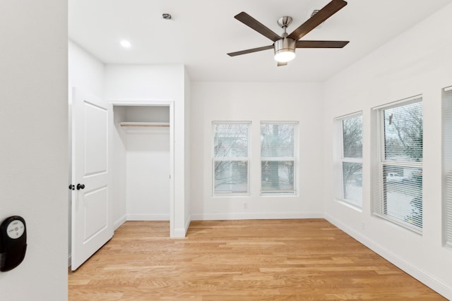 unfurnished bedroom featuring ceiling fan and light hardwood / wood-style floors