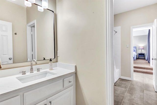 bathroom featuring tile patterned floors, vanity, and shower / bathtub combination