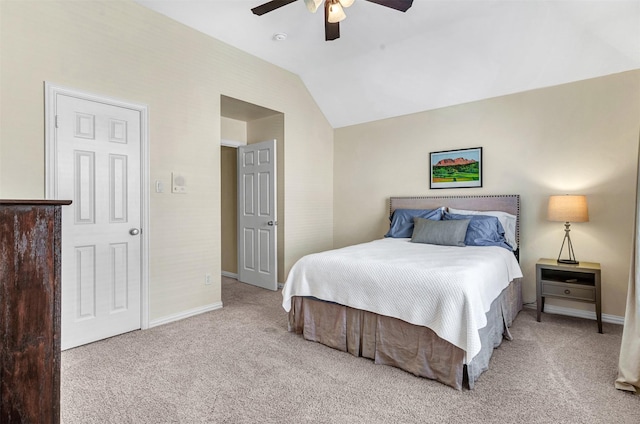 bedroom featuring ceiling fan, light colored carpet, and lofted ceiling