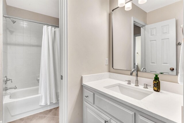 bathroom with tile patterned floors, vanity, and shower / tub combo