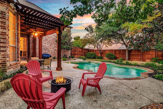 pool at dusk with a patio area and a pergola