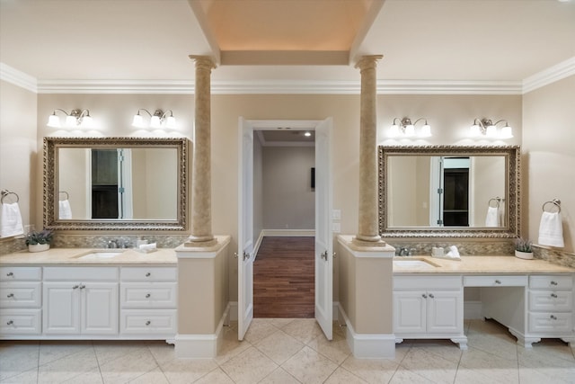 bathroom with two vanities, a sink, ornate columns, and tile patterned floors