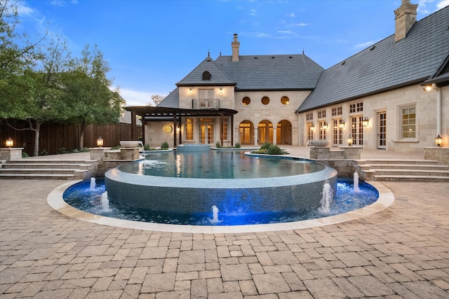 view of swimming pool with a fenced in pool, fence, and a patio