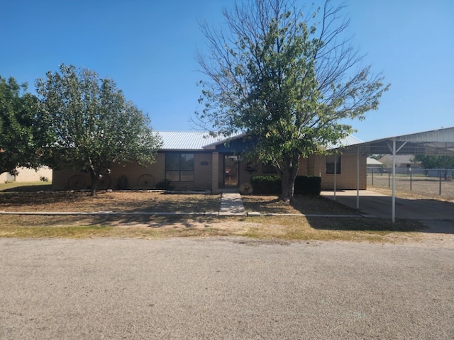 view of front of property with a carport