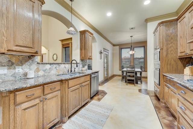 kitchen with decorative light fixtures, light stone countertops, backsplash, and dishwasher