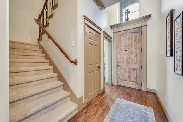 foyer entrance with dark wood-type flooring