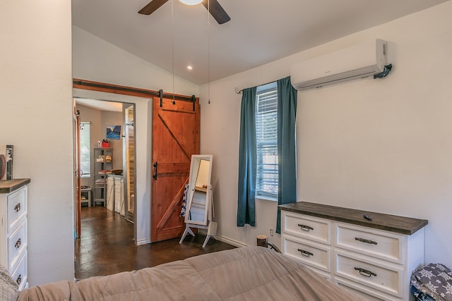 unfurnished bedroom with an AC wall unit, vaulted ceiling, ceiling fan, a barn door, and dark hardwood / wood-style floors