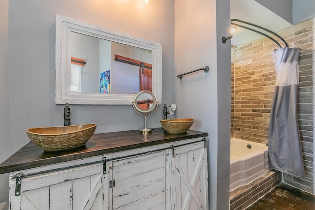 bathroom featuring shower / bath combination with curtain and vanity