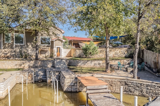 dock area featuring a water view