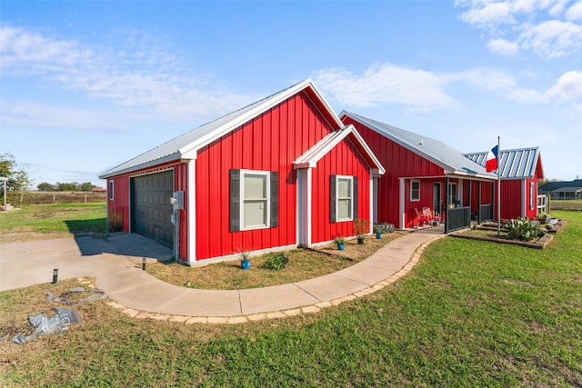 view of outbuilding with a lawn and a garage