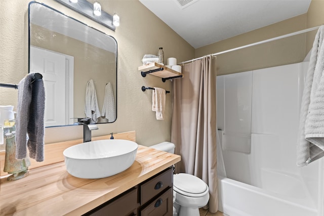 full bathroom featuring vanity, toilet, and shower / bath combo with shower curtain