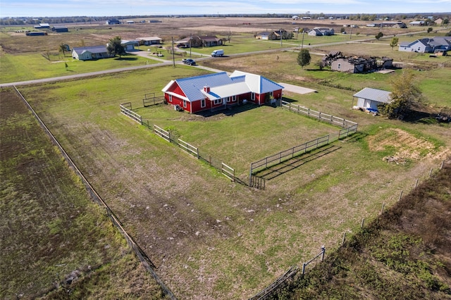 birds eye view of property featuring a rural view