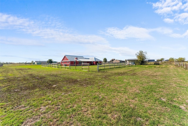 view of yard with a rural view