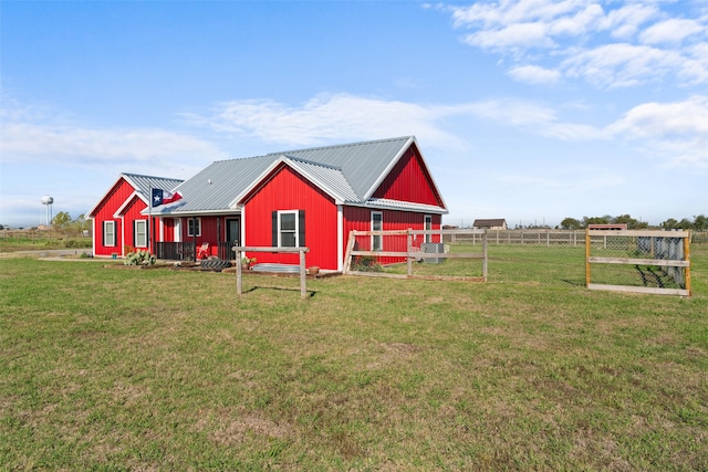 view of outbuilding featuring a lawn