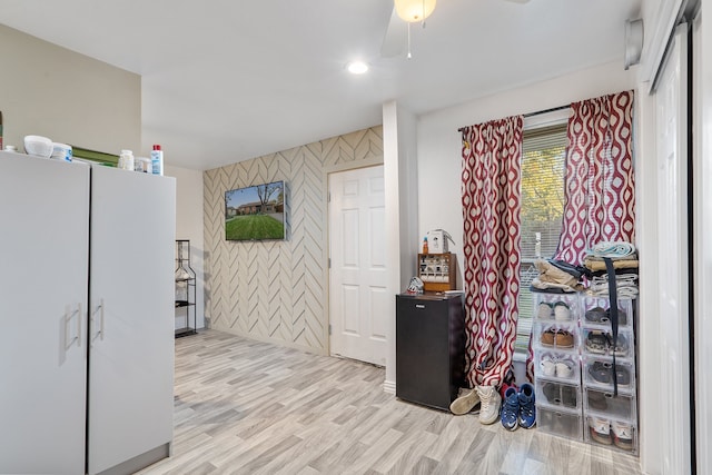 interior space featuring ceiling fan and light hardwood / wood-style flooring