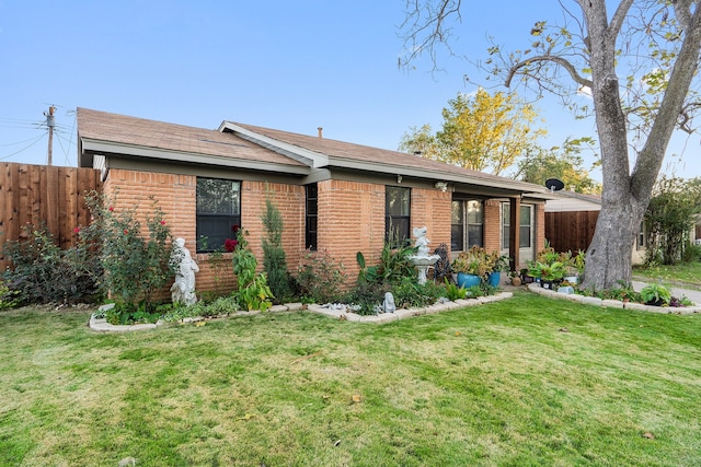 ranch-style house with a front yard