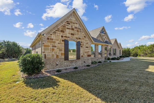 view of property exterior with a lawn