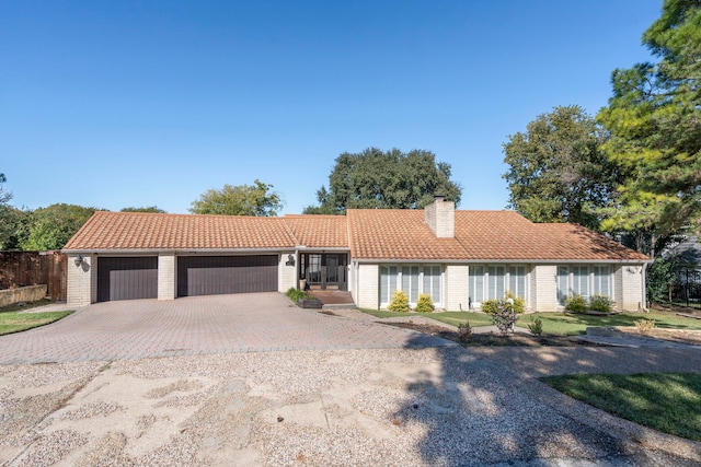 single story home with a garage