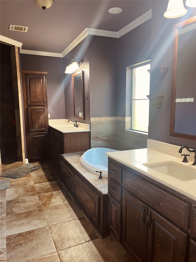 bathroom with a tub, crown molding, vanity, and tile walls