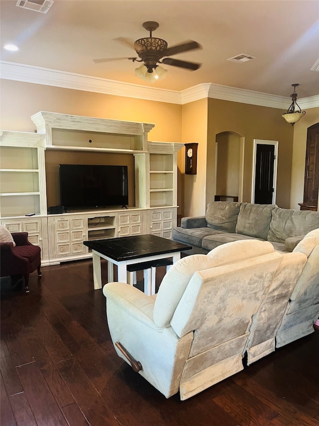 living room featuring ceiling fan, dark hardwood / wood-style flooring, and ornamental molding