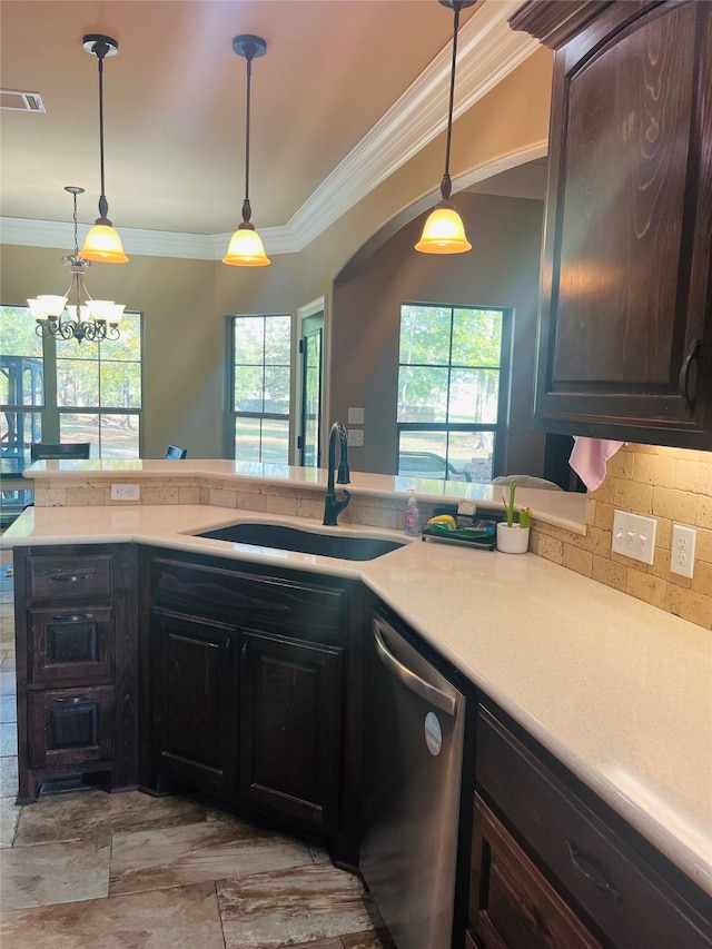 kitchen featuring stainless steel dishwasher, ornamental molding, dark brown cabinetry, sink, and a chandelier