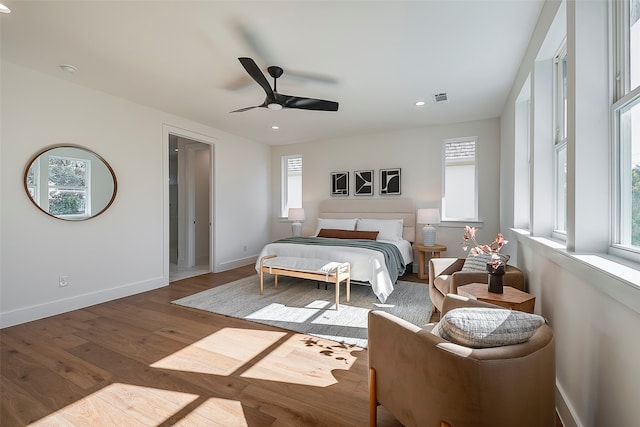 bedroom with wood-type flooring and ceiling fan